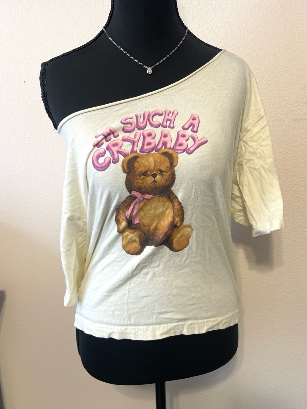 Women's Off-Shoulder 'Such a Crybaby' Bear Graphic Tee - Cream/Pink